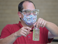 Dean Campbell holding a bottle 