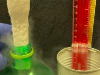 Rectangular polystyrene foam stick shrunken by liquid nitrogen fits into round hole