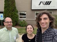 Visitors standing outside the Natural Fiber Welding, Inc. facility