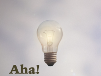 lightbulb w/ text "Aha!"
