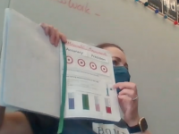 INB Nora Walsh in front of classroom with INB