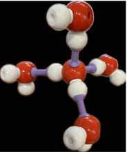 ball & stick model of ice molecule that is tetrahedrally connected to four other water molecules 