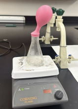 Blowing up a balloon demo - balloon inflating over flask on hotplate