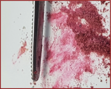 image of crushed Ni compound in a mortar