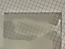 A layer of water on a sheet of etched glass makes it more transparent to see the pattern under the glass