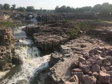 Quartzite outcrops at Sioux Falls, SD, Devils Lake, WI, and Rib Mountain, WI.