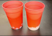 Larger and smaller glass spheres added to thermochromic plastic cups to make them change color
