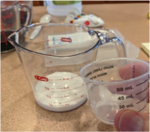 milk of magnesia & vinegar in measuring cups