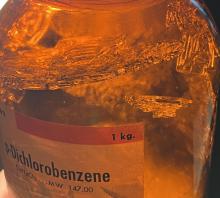 Crystals of p-dichlorobenzene in a sealed amber bottle   