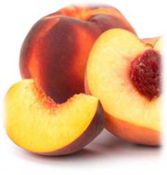 one full peach and one peach cut with pit visible
