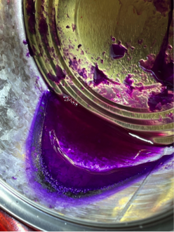 Deposition of purple solid residue