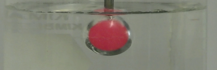 Glowing hot sphere in water