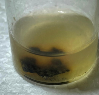 close up view of granular tin covered in sulfide deposits 