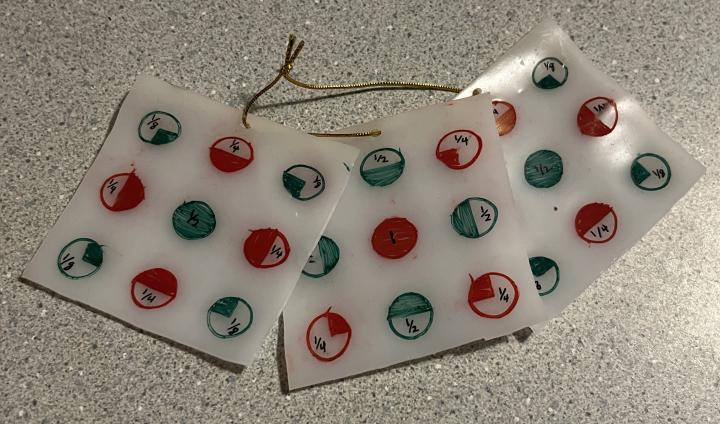 Heat-shrunken models of the layers of face-centered cubic and rock salt unit cells. 