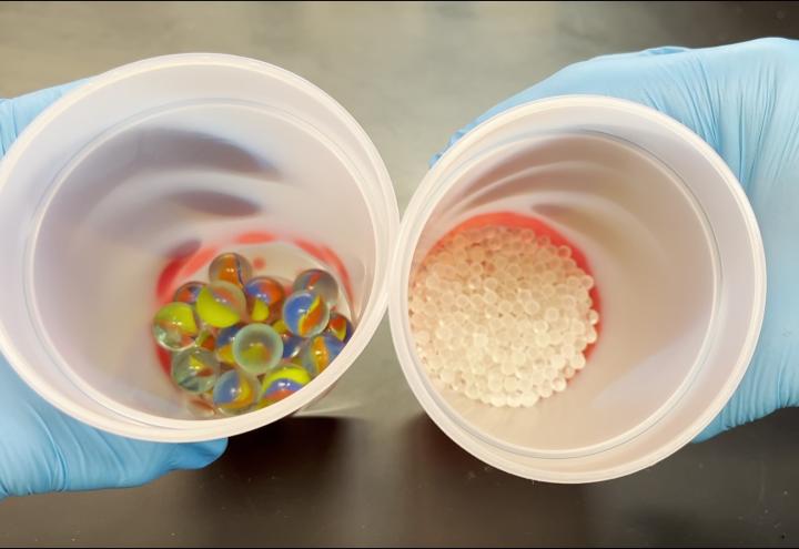 Larger and smaller glass spheres added to thermochromic plastic cups to make them change color