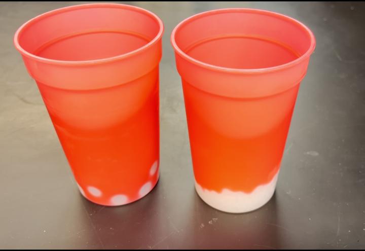 Larger and smaller glass spheres added to thermochromic plastic cups to make them change color