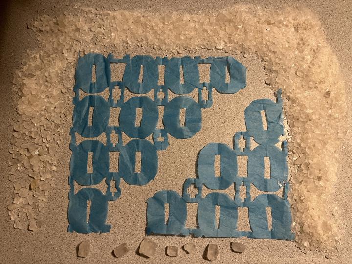 Cut tissue paper banners modeling fracture of ionic crystals