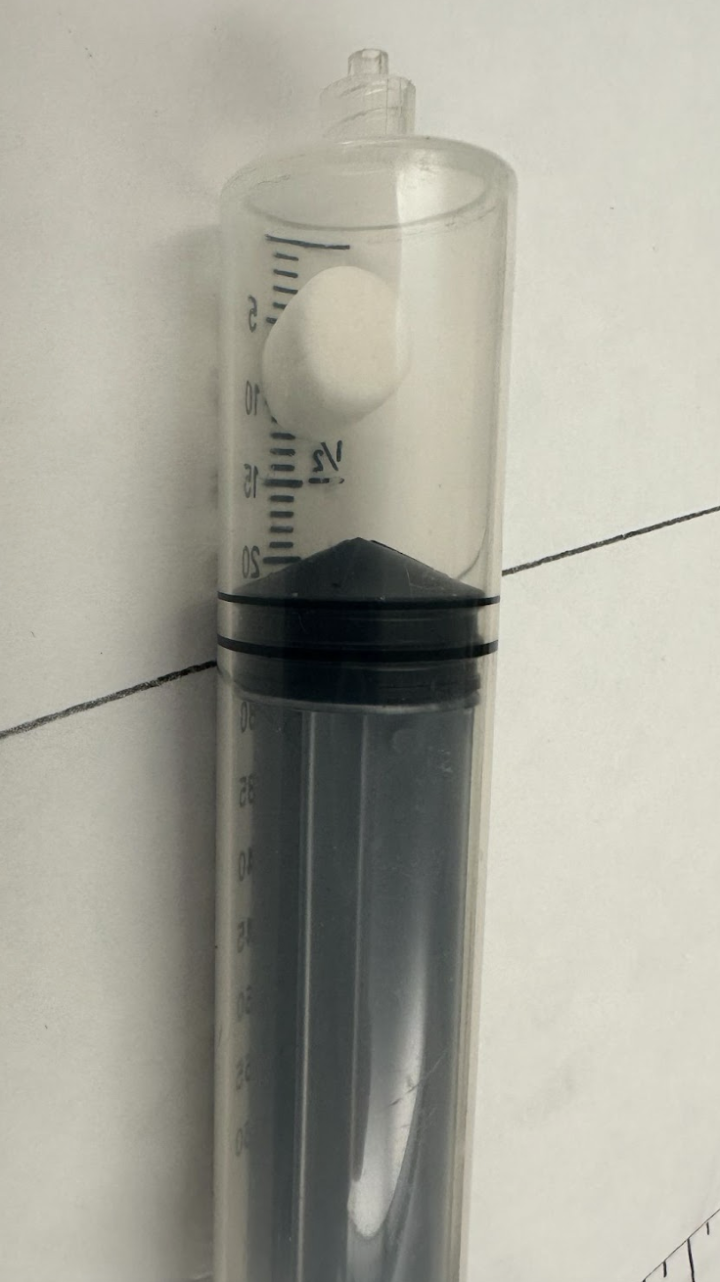 Close-up of mini marshmallow in a syringe