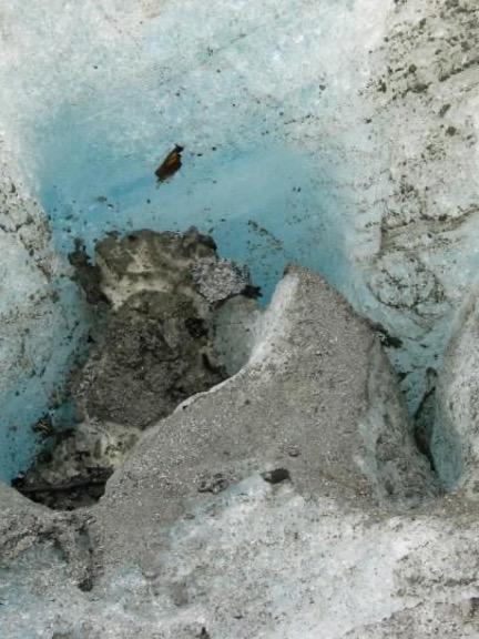 ALT TEXT: (LEFT) Single vs. stack of ten frosted and unfrosted glass slides, and (RIGHT) small hole in glacier ice showing blue color.