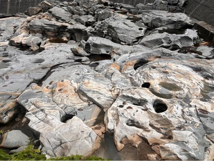 (TOP LEFT) Large boulder, (TOP RIGHT) scratches and “chatter marks” in a smooth rock formation, and (BOTTOM) holes drilled into bedrock by glacier-fed waters swirling stones in circles.