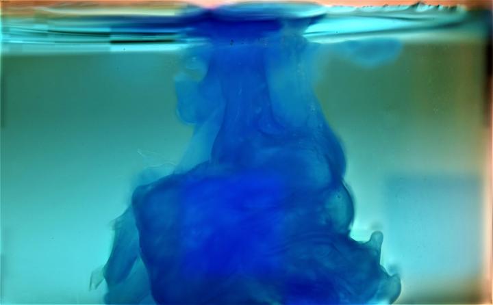 blue precipitate of copper hydroxide forming in lighter blue solution