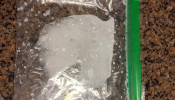 clear plastic sandwich bag with white powder inside