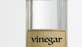 clear glass bottle labeled as "vinegar"