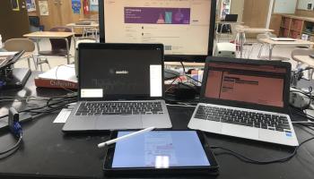 Ariel's computer set up: 1 desktop, 2 laptops and an iPad