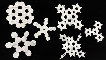 A selection of folded and cut paper patterns