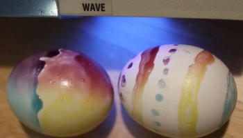 UV light shining on parts of Easter eggs bearing photochromic paint