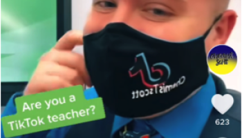 the author wearing a mask in his classroom