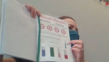 Nora Walsh in front of classroom with INB