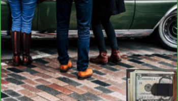 legs by a vehicle and a wallet with cash