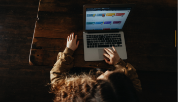 view from above a teenage girl using laptop computer
