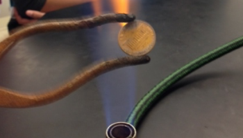 zinc coated penny heated to form brass alloy