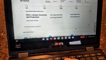 desktop computer monitor with AP website on screen