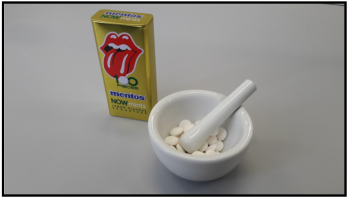 Mentos Now candy in a mortar and pestle