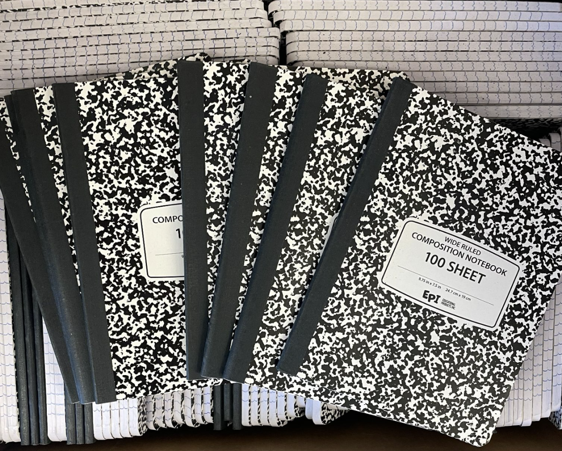 several piles of composition notebooks