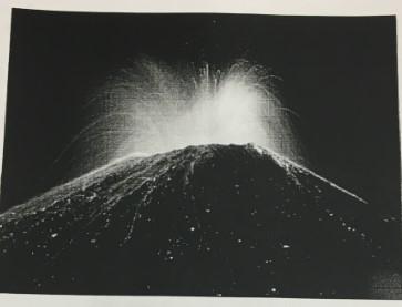 black & white image of volcano erupting