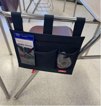 pouch hanging with velcro attachment on the side of student desks