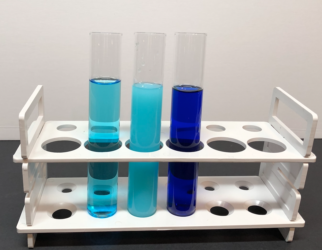 3 test tubes holding copper solutions