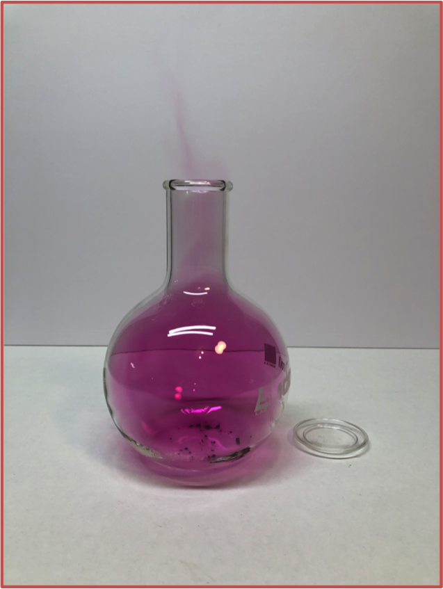 violet vapor in a round bottom flask